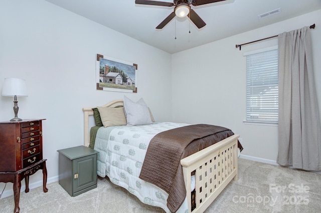 bedroom featuring light colored carpet and ceiling fan