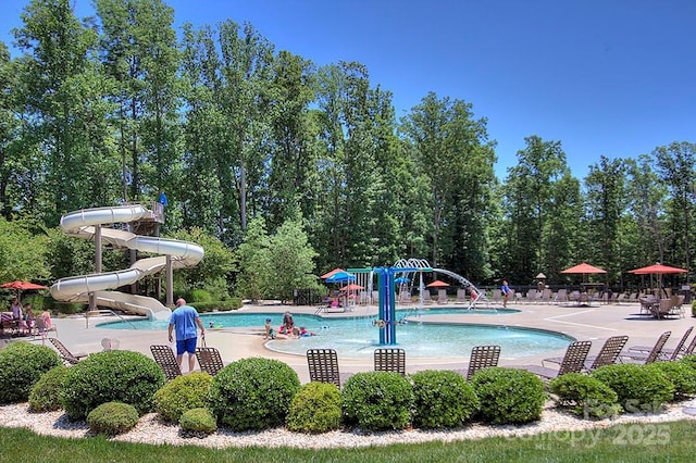 view of pool with a water slide