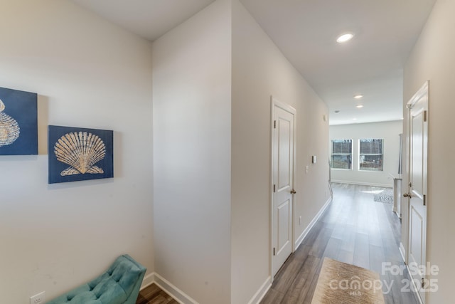 hall with hardwood / wood-style flooring