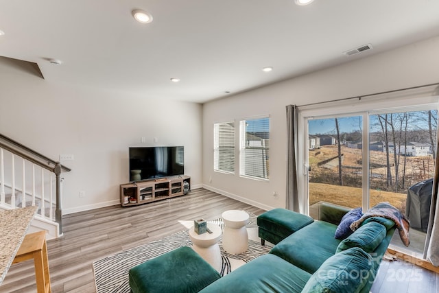 living room with light hardwood / wood-style flooring