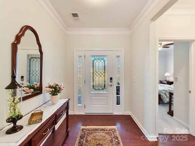 foyer featuring dark hardwood / wood-style flooring and ornamental molding