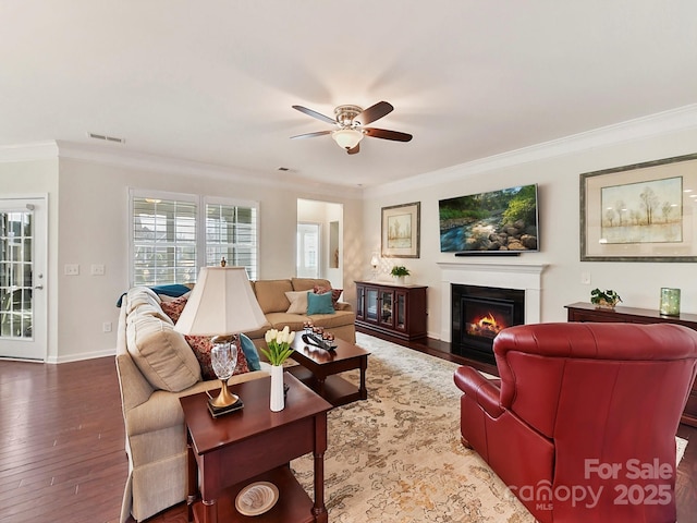 living room featuring crown molding, ceiling fan, and hardwood / wood-style floors