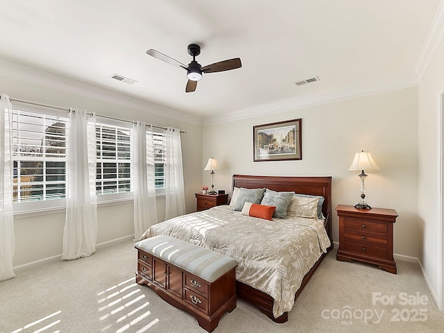 bedroom featuring ornamental molding, light carpet, and ceiling fan