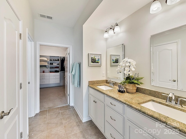 bathroom with vanity and tile patterned flooring