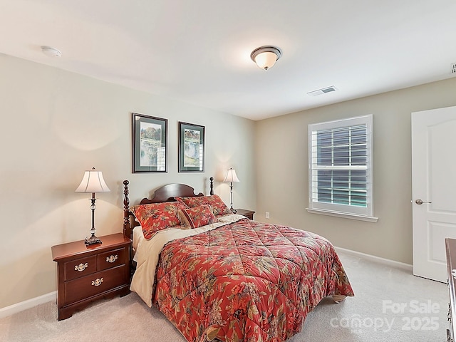 bedroom featuring light carpet