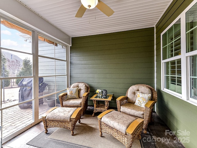 sunroom featuring ceiling fan