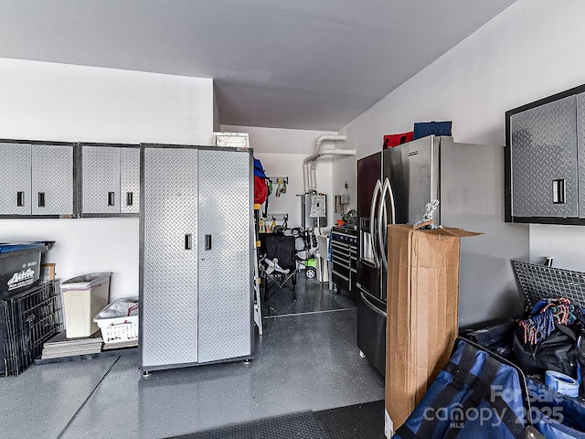 interior space featuring stainless steel fridge with ice dispenser