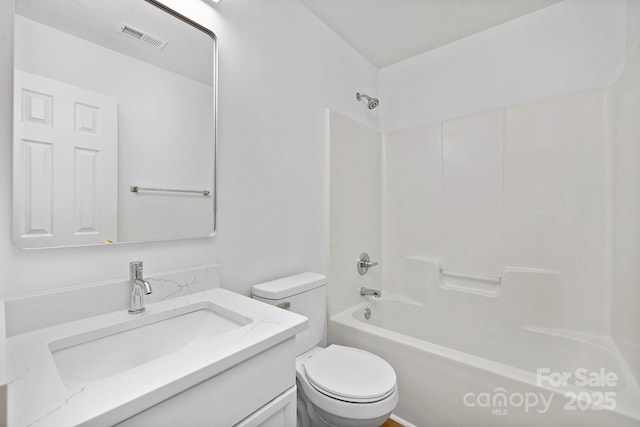 full bathroom with shower / tub combination, vanity, and toilet