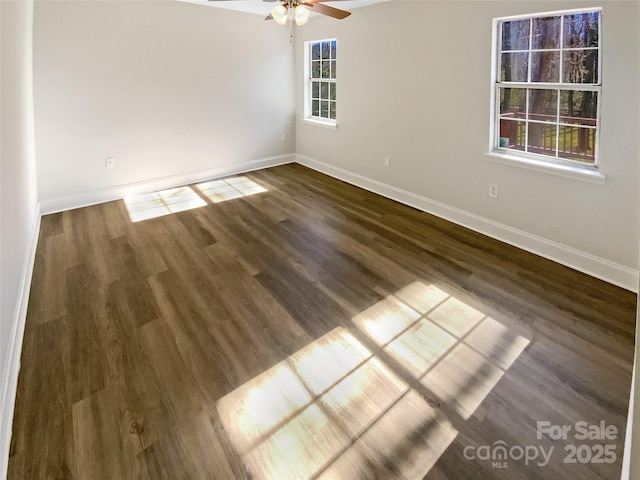 unfurnished room with dark wood-type flooring and ceiling fan