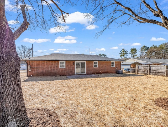 rear view of property featuring cooling unit