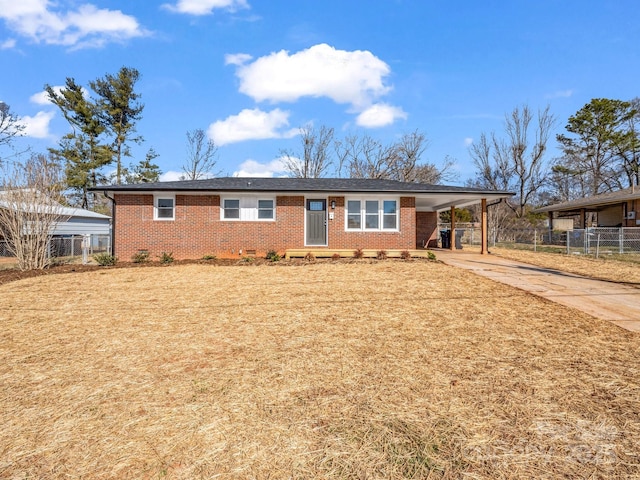 single story home featuring a carport