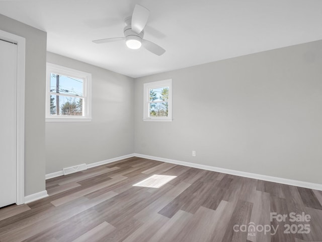 unfurnished room featuring wood-type flooring and ceiling fan