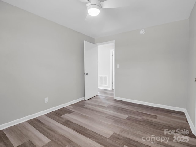 unfurnished room featuring ceiling fan and light hardwood / wood-style flooring