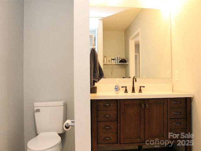 bathroom with vanity and toilet