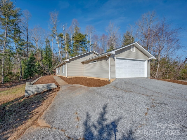 view of side of property with a garage