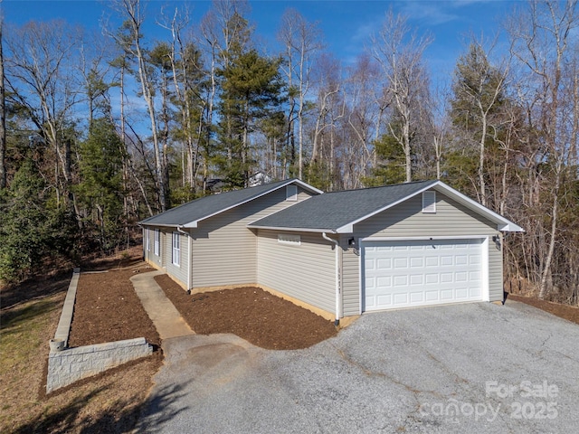 view of side of property featuring a garage