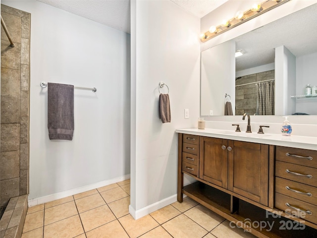 bathroom featuring tile patterned flooring, vanity, curtained shower, and a textured ceiling