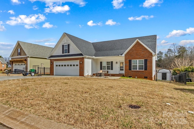 view of front of house featuring a garage and a front yard