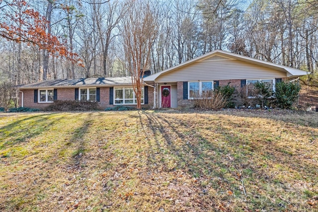 single story home featuring a front lawn