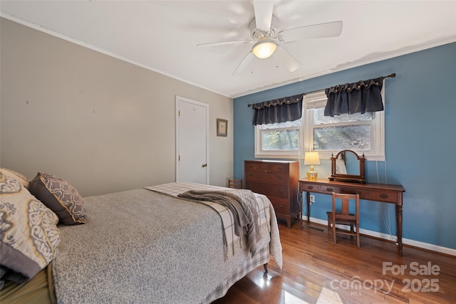 bedroom with hardwood / wood-style flooring and ceiling fan