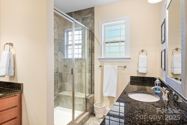 bathroom with vanity and an enclosed shower