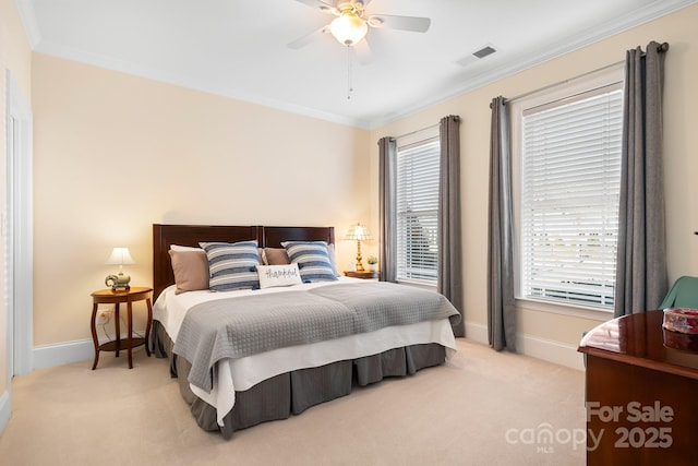 bedroom with crown molding, light colored carpet, and ceiling fan