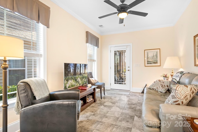 living room featuring crown molding and ceiling fan