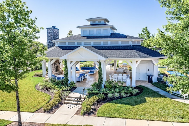 view of community with a gazebo, outdoor lounge area, a yard, and a patio area