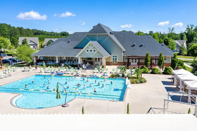 view of pool with a patio area and a pergola