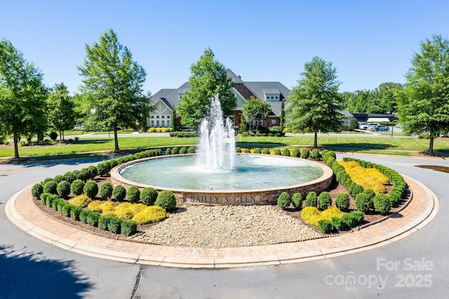 view of home's community with a yard