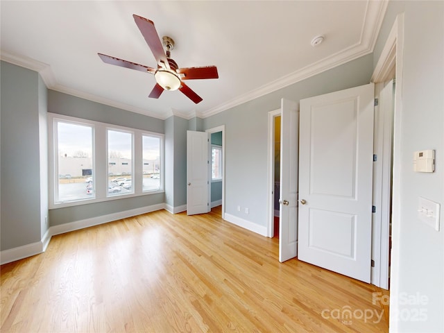 unfurnished bedroom featuring ceiling fan, ornamental molding, and light hardwood / wood-style floors