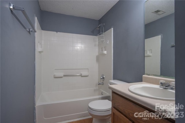 full bathroom with vanity, a textured ceiling, toilet, and shower / bath combination