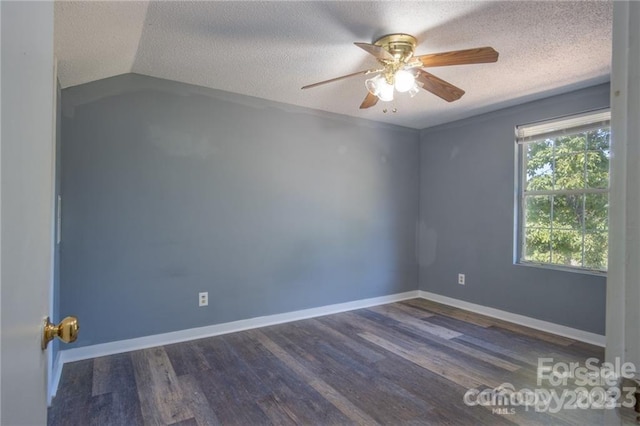 spare room with ceiling fan, dark hardwood / wood-style flooring, and a textured ceiling