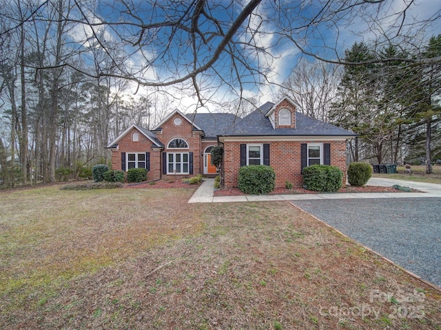 ranch-style home with a front lawn