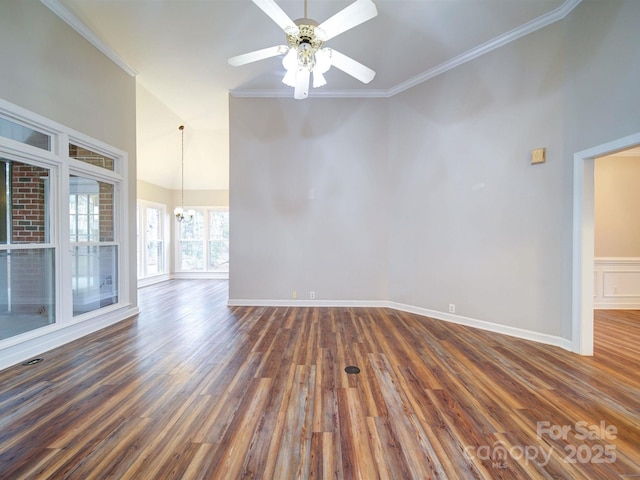 spare room featuring high vaulted ceiling, ceiling fan with notable chandelier, dark wood-type flooring, and ornamental molding