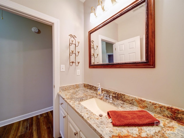 bathroom featuring vanity and wood-type flooring