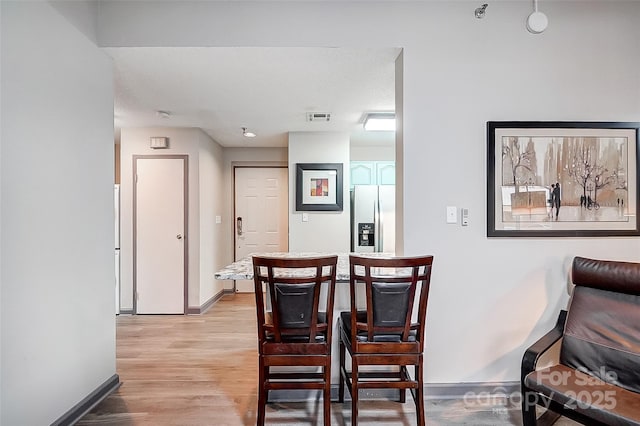 dining area featuring light hardwood / wood-style floors