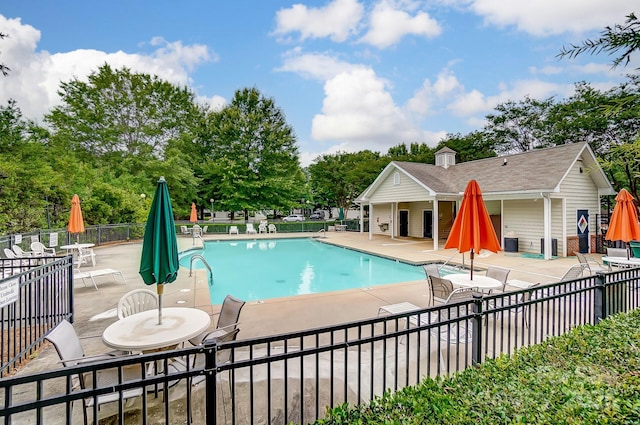 view of swimming pool featuring a patio area