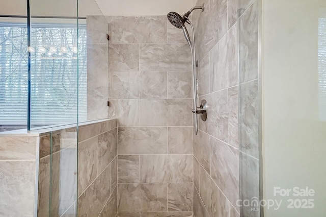 bathroom featuring tiled shower