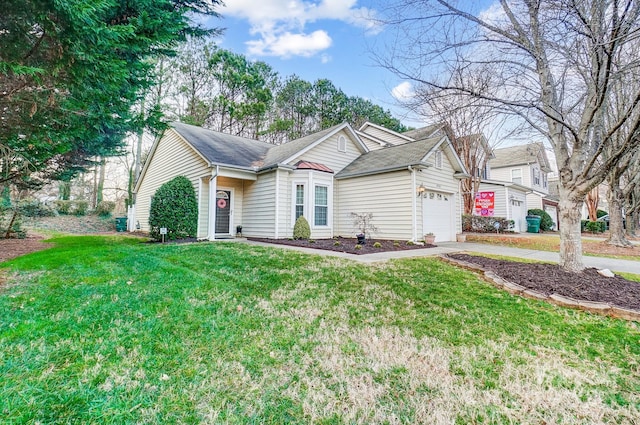 view of front of house featuring a garage and a front lawn