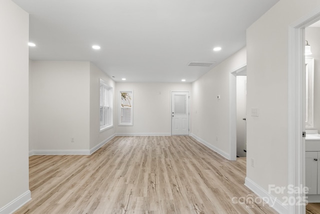 unfurnished room with light hardwood / wood-style floors