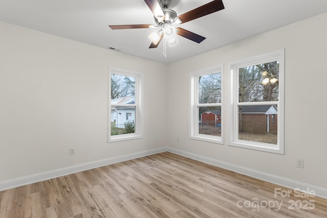 unfurnished room with ceiling fan and light wood-type flooring