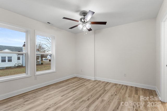 spare room featuring ceiling fan and light hardwood / wood-style flooring