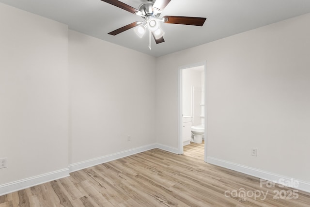 empty room featuring ceiling fan and light hardwood / wood-style floors