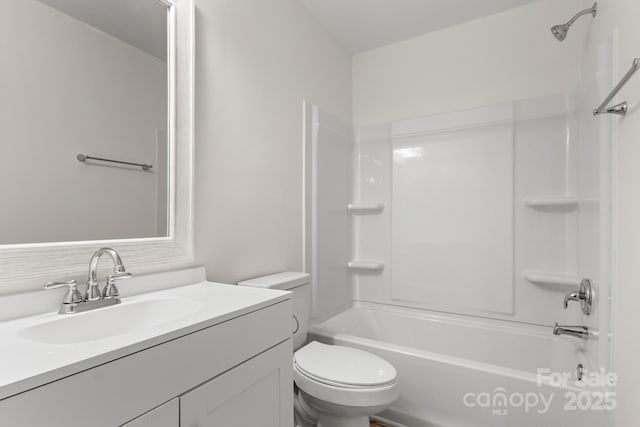 full bathroom with vanity,  shower combination, and toilet