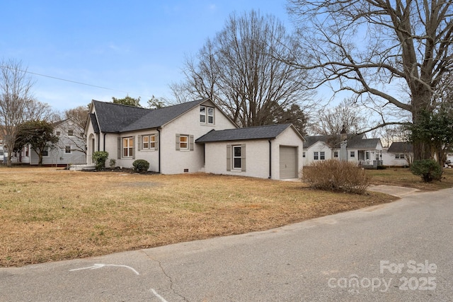 view of front facade with a garage and a front yard