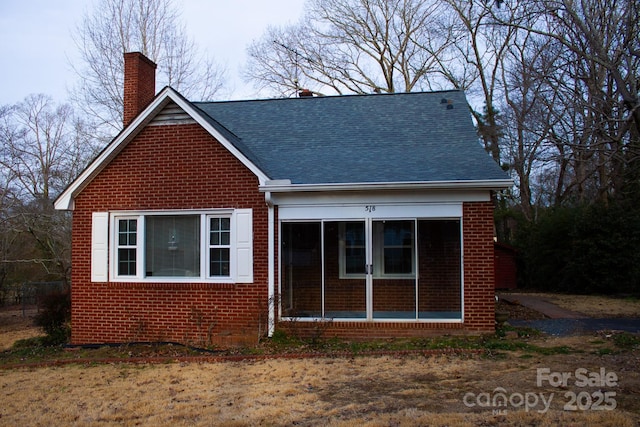 back of property featuring a sunroom