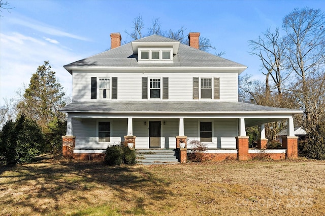 view of front facade with a front yard and a porch