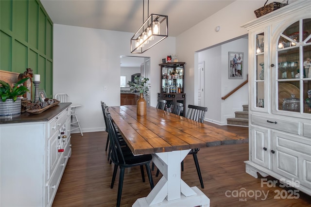 dining space featuring dark wood-type flooring