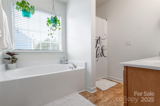 bathroom featuring vanity, plus walk in shower, and tile patterned flooring